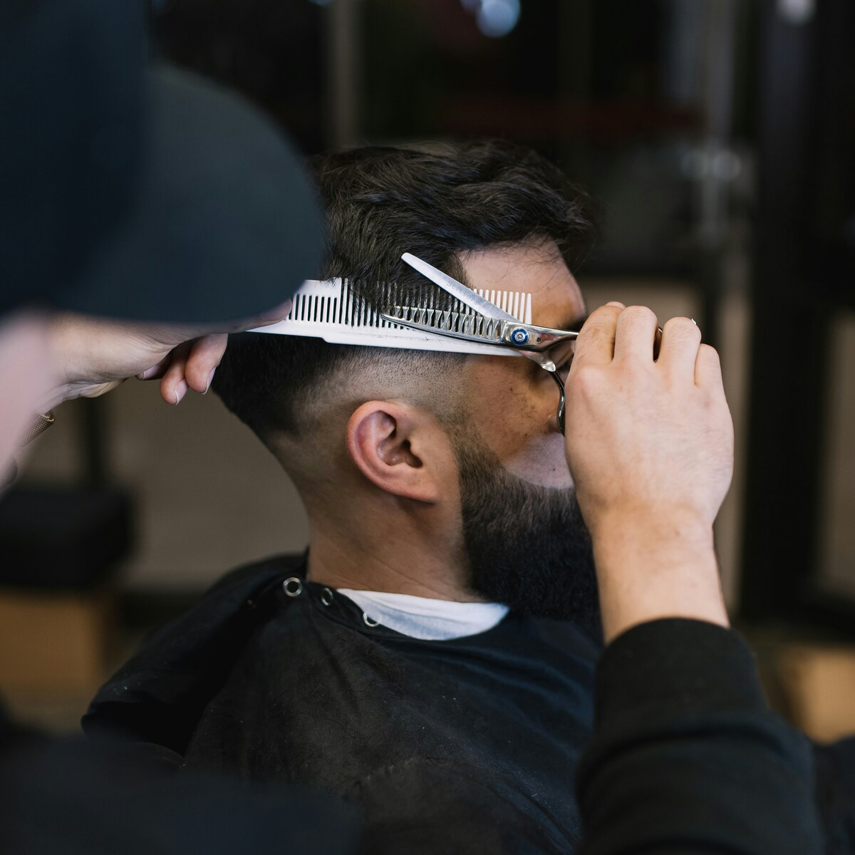 Barber cutting hair