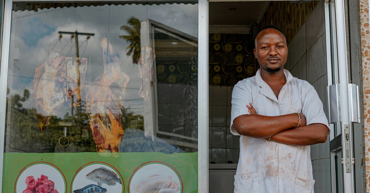Shop owner outside storefront